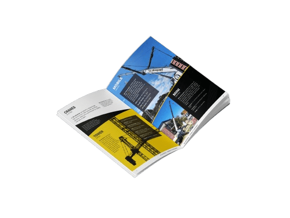 An open magazine or brochure displaying images and information about construction cranes, featuring photos of cranes and sections with yellow and black backgrounds.